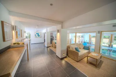 a living room with a couch and a table at House 22 in Looe