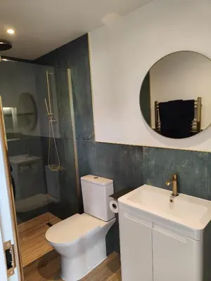 a bathroom with a toilet and a sink and a mirror at Ocean Heart Studio- Luxury, Rural Retreat in Wendron