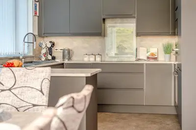 a kitchen with gray cabinets and a sink at 2 Bed in Newquay oc-b32399 in Holywell Bay