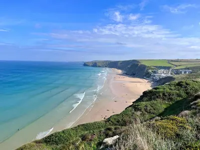 an aerial view of a beach with the ocean at 2 Bed in Newquay oc-b32399 in Holywell Bay