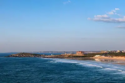a view of the shoreline of a beach at Surfside in Newquay