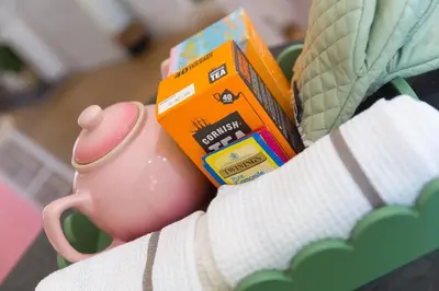 a pink toy mug and a box of energy drink at Pebble in Carbis Bay
