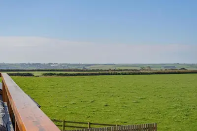 a view of a green field with a fence at 3 Bed in St. Mawgan oc-h30677 in Saint Eval