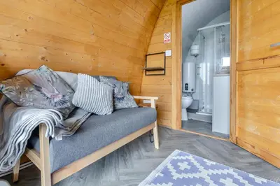 a couch sitting in a room with a bathroom at 1 Bed in Four Lanes oc-s32768 in Carnbrea