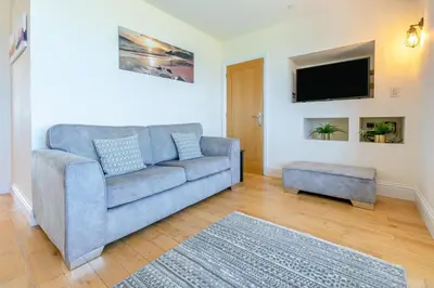 a living room with a couch and a tv at 3 Bed in Newquay oc-o32259 in Newquay