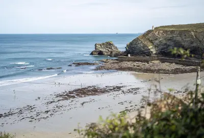 a view of a beach with the ocean at The Gatehouse Apartment in Portreath