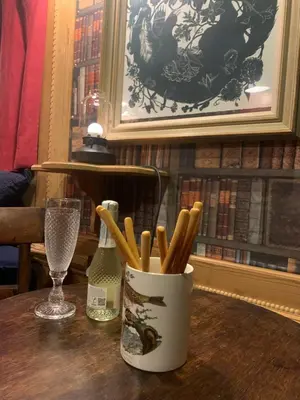 a cup of cinnamon sticks sitting on a table at Rosies in Liskeard