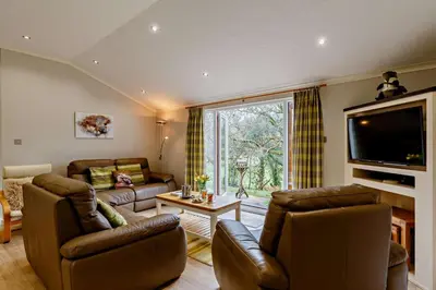 a living room with two couches and a tv at 3 Bed in Two Waters Foot oc-r27336 in Cardinham