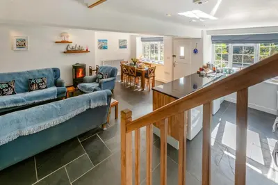 a living room with a couch and a table at 3 Bed in Sithney oc-cpv110 in Carleen