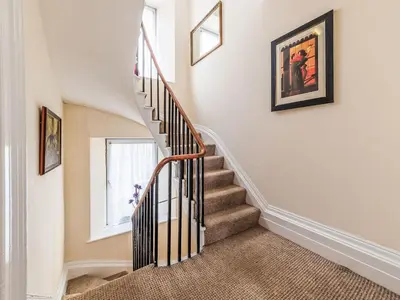 a staircase in a home with a stair case at Holiday Home Tregony House 2 Bedrooms by Interhome in Mevagissey
