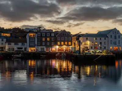 a view of a harbor with buildings and the water at Holiday Home Tregony House 2 Bedrooms by Interhome in Mevagissey