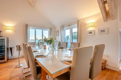a dining room with a table and chairs at 5 Bed in Rock oc-m33185 in Roche