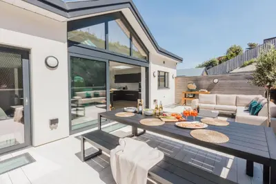 a patio with a table with food on it at Aurora Skies in Porthtowan