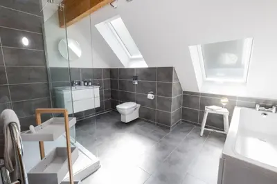 a bathroom with a toilet and a sink at Tides Edge in Portreath