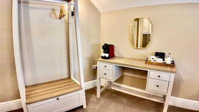 a bathroom with a mirror and a sink at Rising Sun Inn - Rough Tor in Altarnun