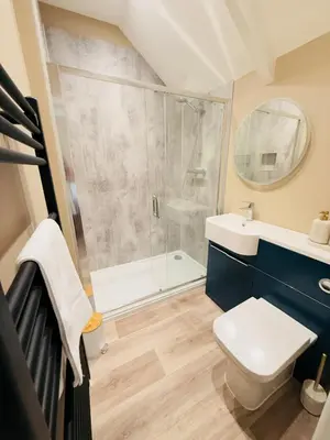 a bathroom with a shower and a toilet and a sink at Rising Sun Inn - Kil Margh in Altarnun