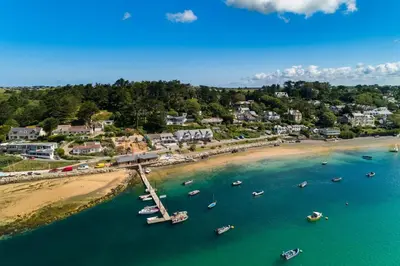 an aerial view of a beach with boats in the water at 5 Bed in Trebetherick oc-t33296 in Polzeath