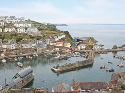 a group of boats in the water in a harbor at Barn 2 in St Austell