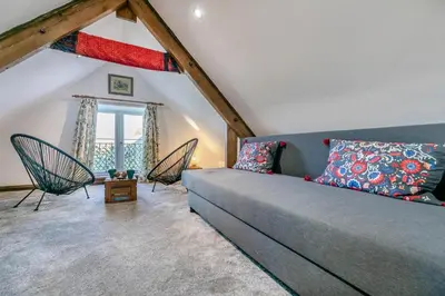 a living room with a couch and two chairs at 1 Bed in Menheniot oc-t29268 in Menheniot