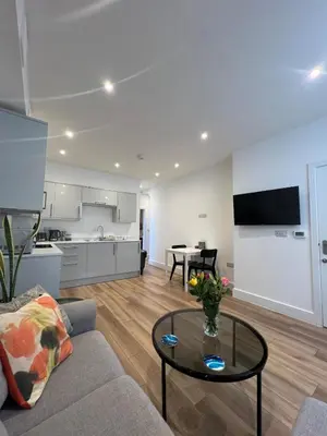 a living room with a couch and a table at 1 Bed Apartment in Town Centre in Newquay