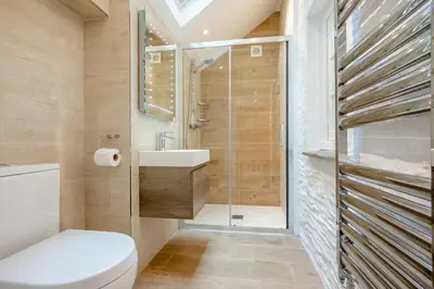 a bathroom with a shower and a toilet and a sink at 3 Bed in Polperro oc-h34100 in Polperro