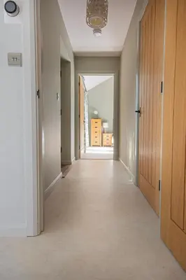 an empty hallway with a door leading into a room at Lowenna at Cusgarne Manor, rural, accessible in Cusgarne