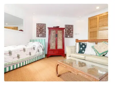 a living room with a couch and a coffee table at The Hexagon House in Penzance