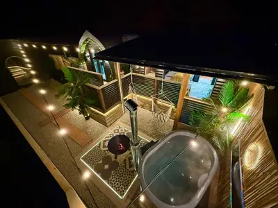 an overhead view of a bathroom sink with lights at The Secret Garden Glamping Cornwall in Cury