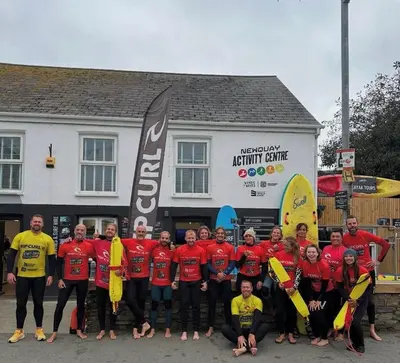 a group of people posing for a picture in front of a building at The Palms Cottage Exclusive Use 3 Bedroom Parking Central Newquay in Newquay