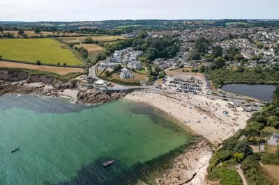 an aerial view of a beach with a group of people at Bright Flat with Estuary Views & Parking Falmouth in Falmouth
