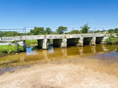 an old stone bridge over a river at Organ Loft North Coast moorland on the doorstep in Saint Breward