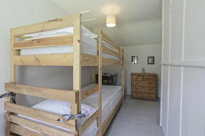 a bedroom with two bunk beds in a room at The Barn in Camelford