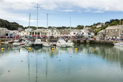 a group of boats are docked in a harbor at Rosemary Cottage Edmonton set in the countryside in Wadebridge