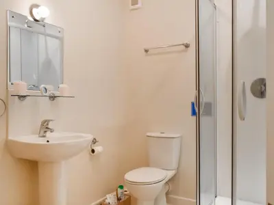 a bathroom with a toilet and a sink and a shower at Milking Parlour - Uk49026 in Liskeard