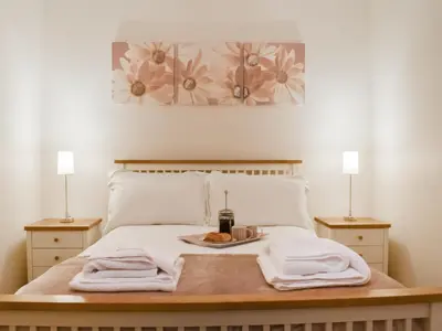 a bed with a plate of food on top of it at Milking Parlour - Uk49026 in Liskeard