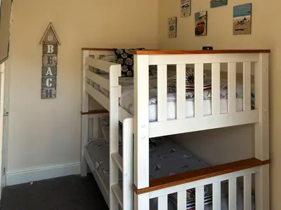 a bunk bed in a childs room at Seagull Cottage in Looe