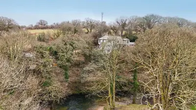 an aerial view of a house in a field with trees at 2 Bed in Tresarrett oc-b34255 in Blisland