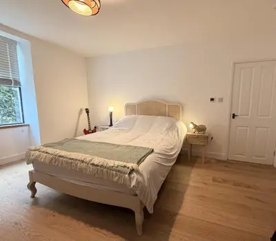 a bedroom with a bed and a window at 4 Bed in Bugle oc-f34175 in Penwithick