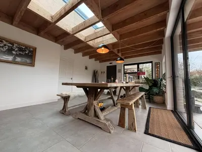 a large dining room with a wooden table and benches at 4 Bed in Bugle oc-f34175 in Penwithick