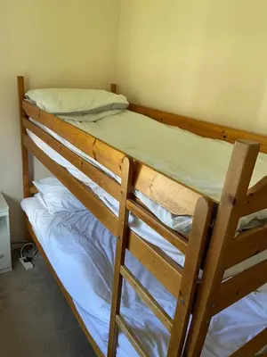 a pair of bunk beds in a room at Bolthole in Hayle