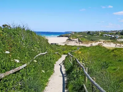 a path leading down a hill to a beach at Elm - 31304 in Porthtowan