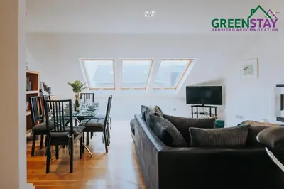 a living room with a couch and a table at 