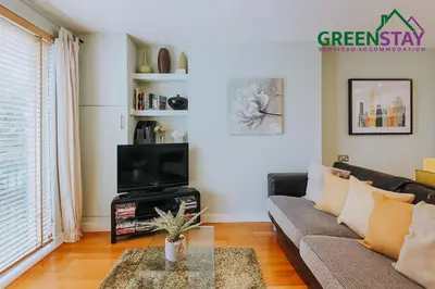 a living room with a couch and a tv at 