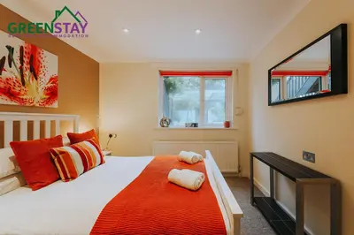a bedroom with a large bed and a window at 