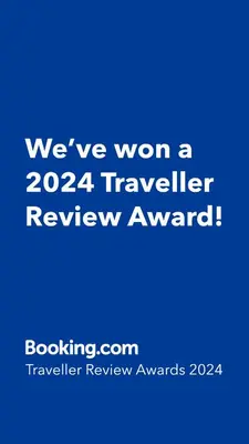 a blue sign that says weve won a traveler review award at Horizons Apartments Newquay in Newquay