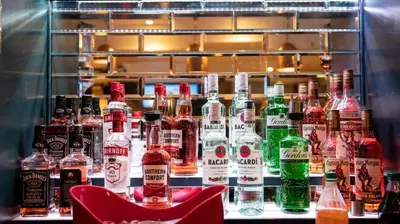 a display of bottles of alcohol on a shelf at Tyacks Hotel in Camborne