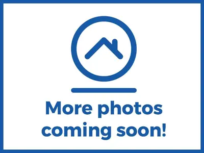 a sign that says more photos coming soon at 47 Bredon Court in Newquay