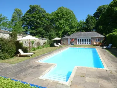 a swimming pool in the backyard of a house at The Bullshed in Saint Erth