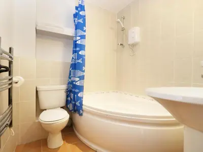 a small bathroom with a toilet and a sink at The Old Granary in Launceston