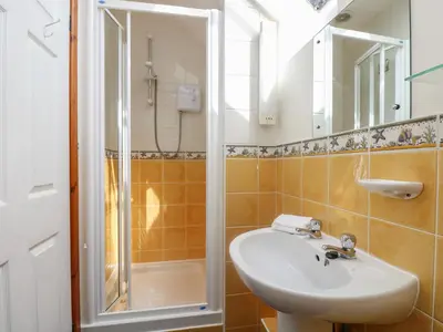a bathroom with a sink and a shower at The Wagon House in Launceston
